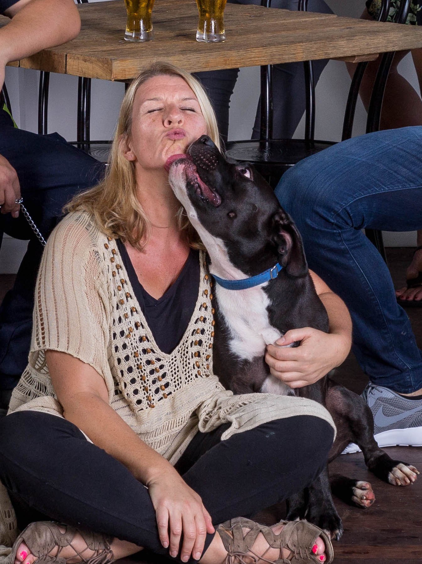 Amy Cooper being kissed by her dog