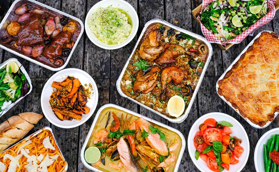 Flatlay of a variety of ready made meals on a table