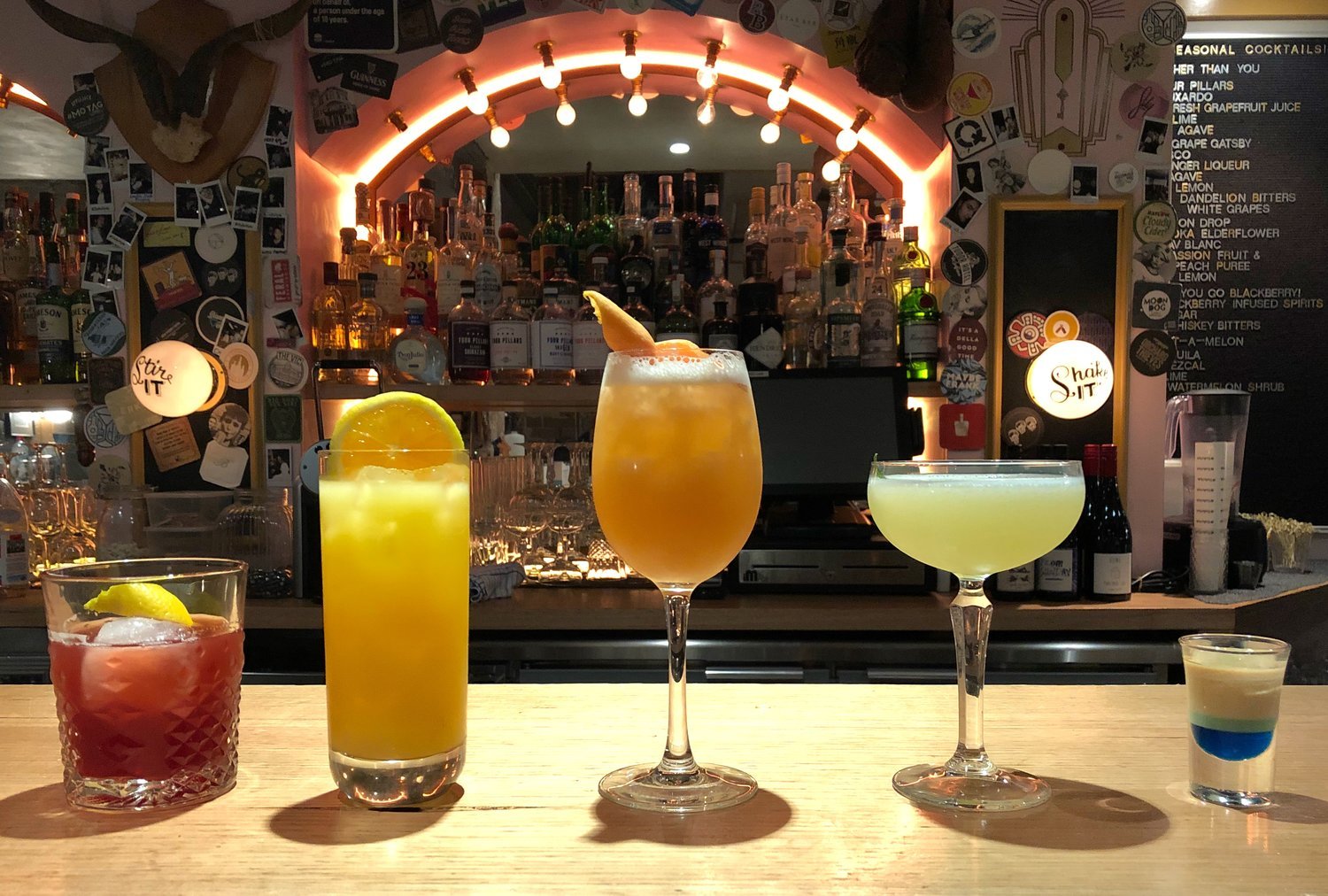 5 cocktails, each a different colour symbolising an arched rainbow