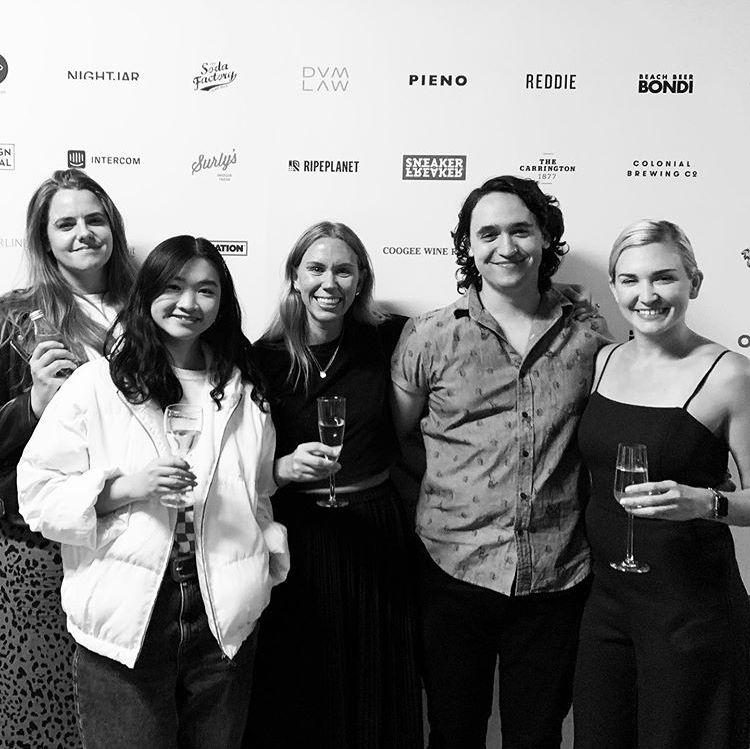 The Sydney Design Social team posing in front of a wall