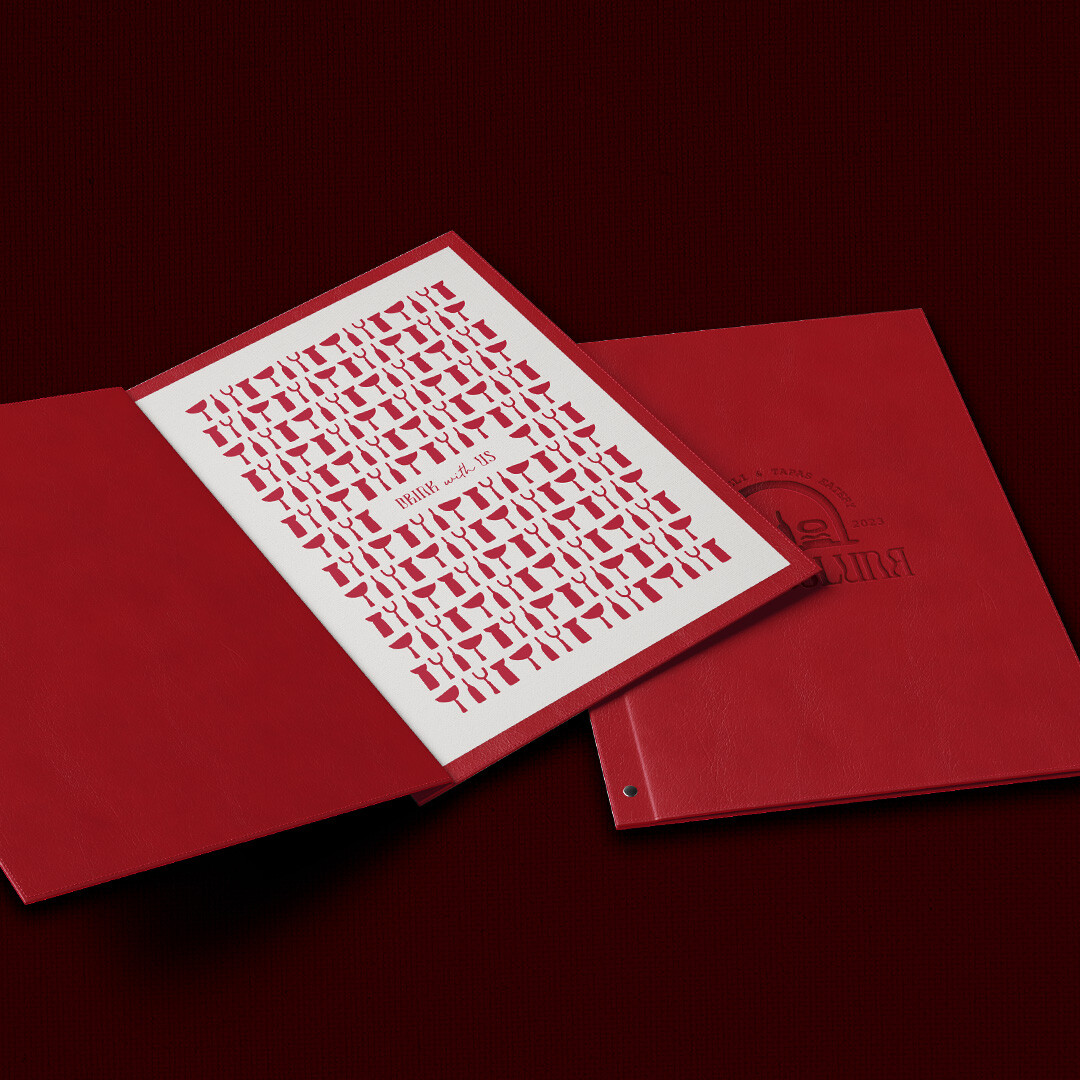 Red menu laying open on maroon background.