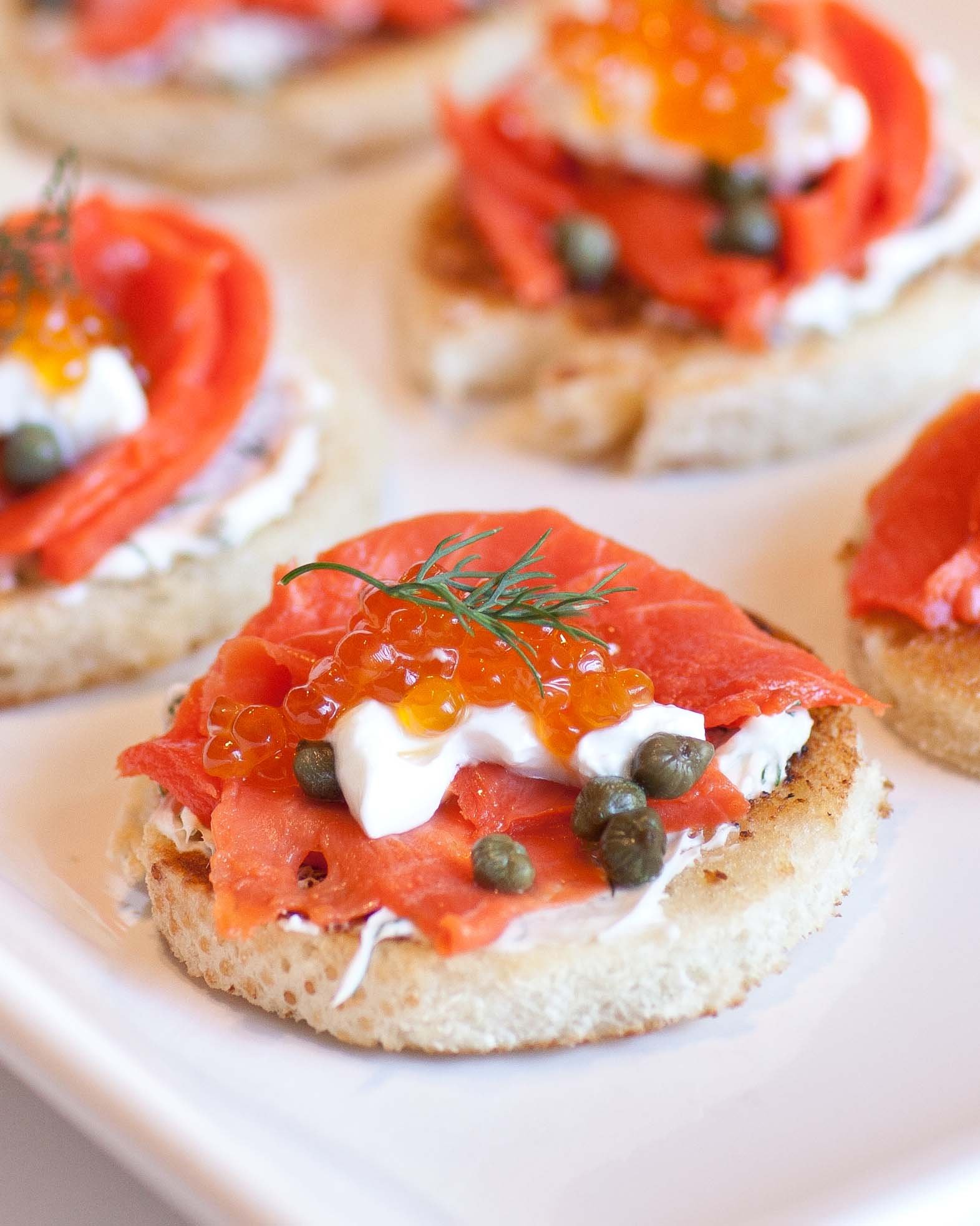 Caviar and smoked salmon canapes topped with capers and dill